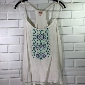 Cream tank top with blue and green design on front